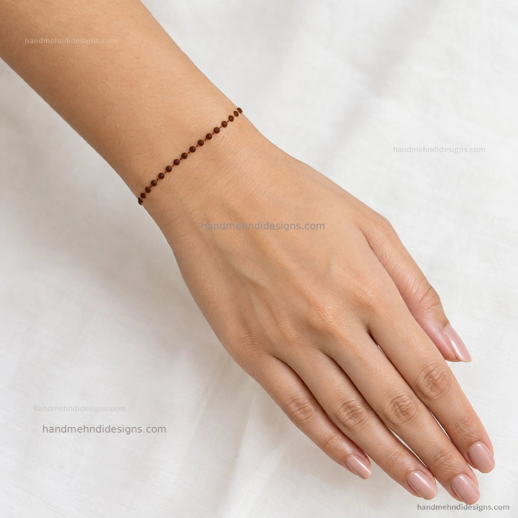 Simple wrist dot mehndi design arranged as a delicate dotted bracelet band
