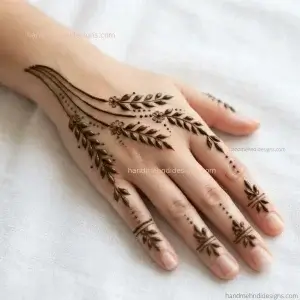 Back hand mehndi featuring three delicate leafy branches meeting at the center