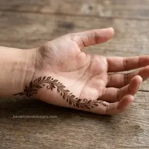 Side palm featuring a thin leafy vine flowing along the outer edge while keeping the center clear