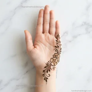 Side palm floral mehndi with two small flowers, curved leafy stems, and tiny dots arranged near the thumb.