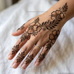 Bold Arabic floral flow back hand mehndi with leafy vine extensions